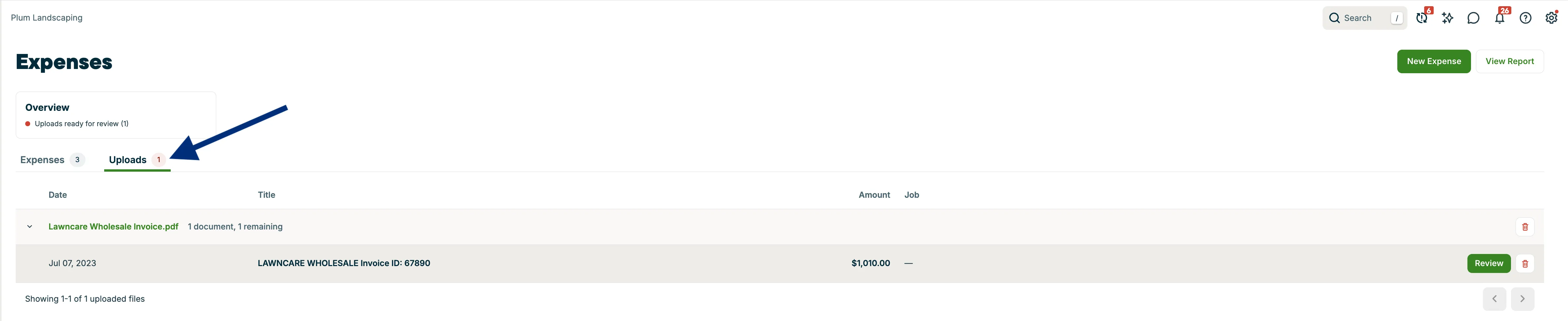 A screenshot highlighting the Uploads tab on the Expenses page.