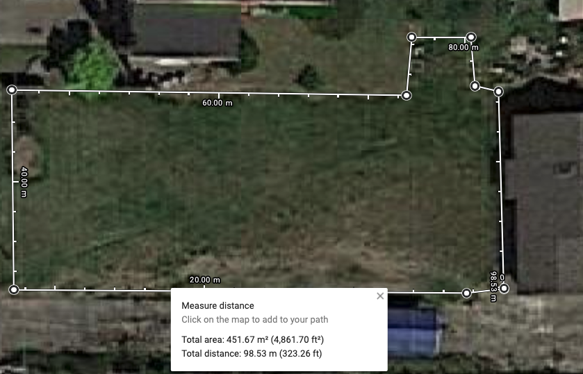satellite image from Google Maps showing a lawn with measurements around it